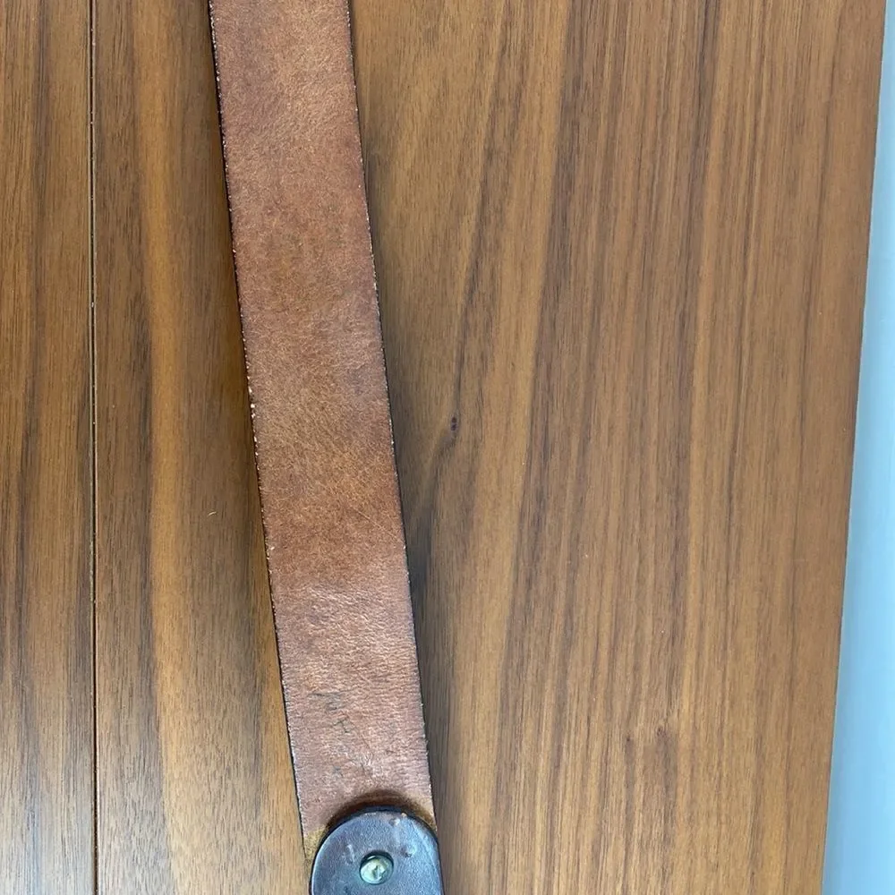 Vintage brown leather hand tooled Western belt.